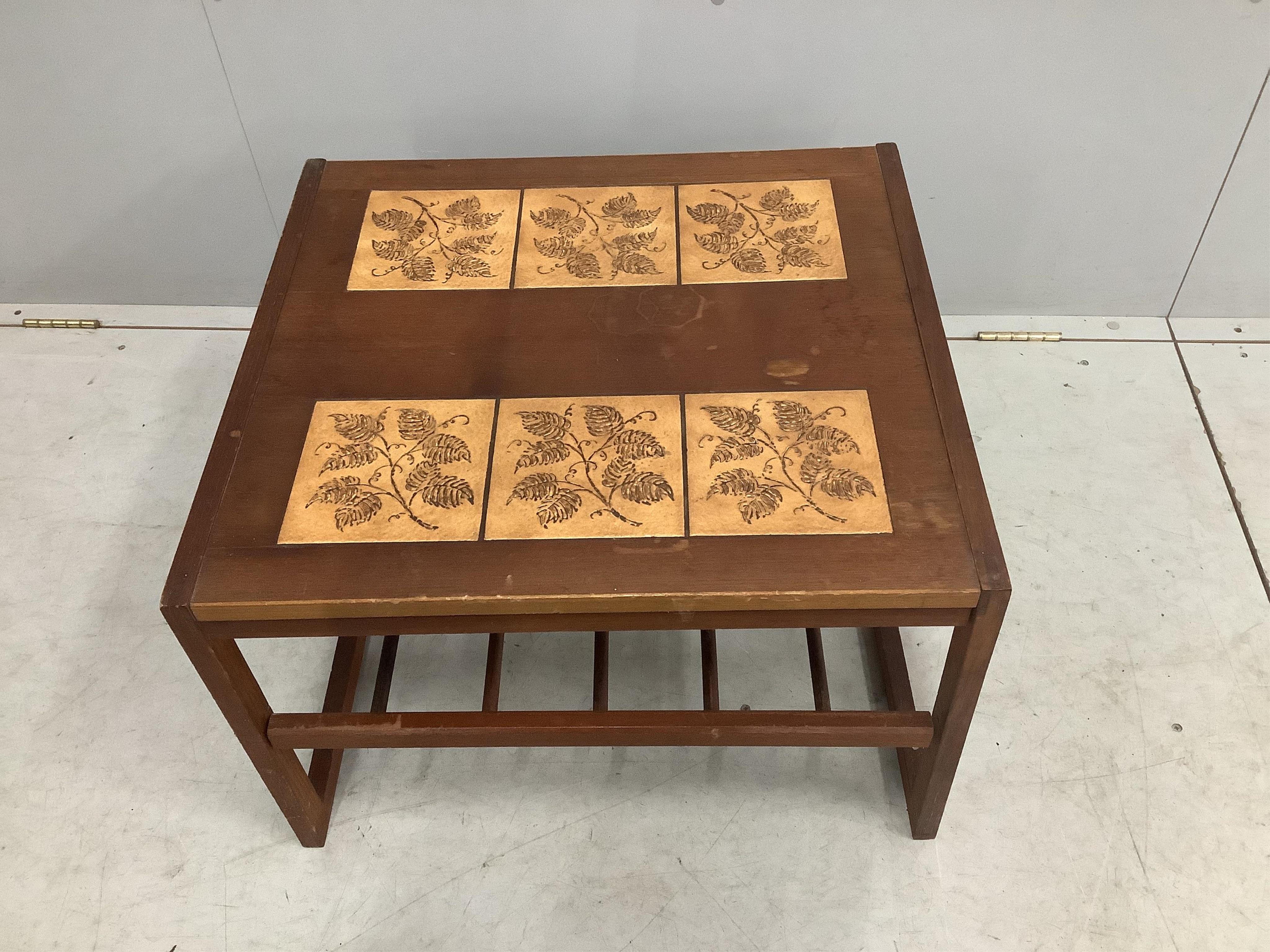 A mid century teak two tier tile top coffee table, width 60cm, depth 54cm, height 42cm. Condition - poor to fair